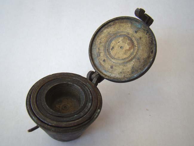 A small 18th century bronze nest of weights